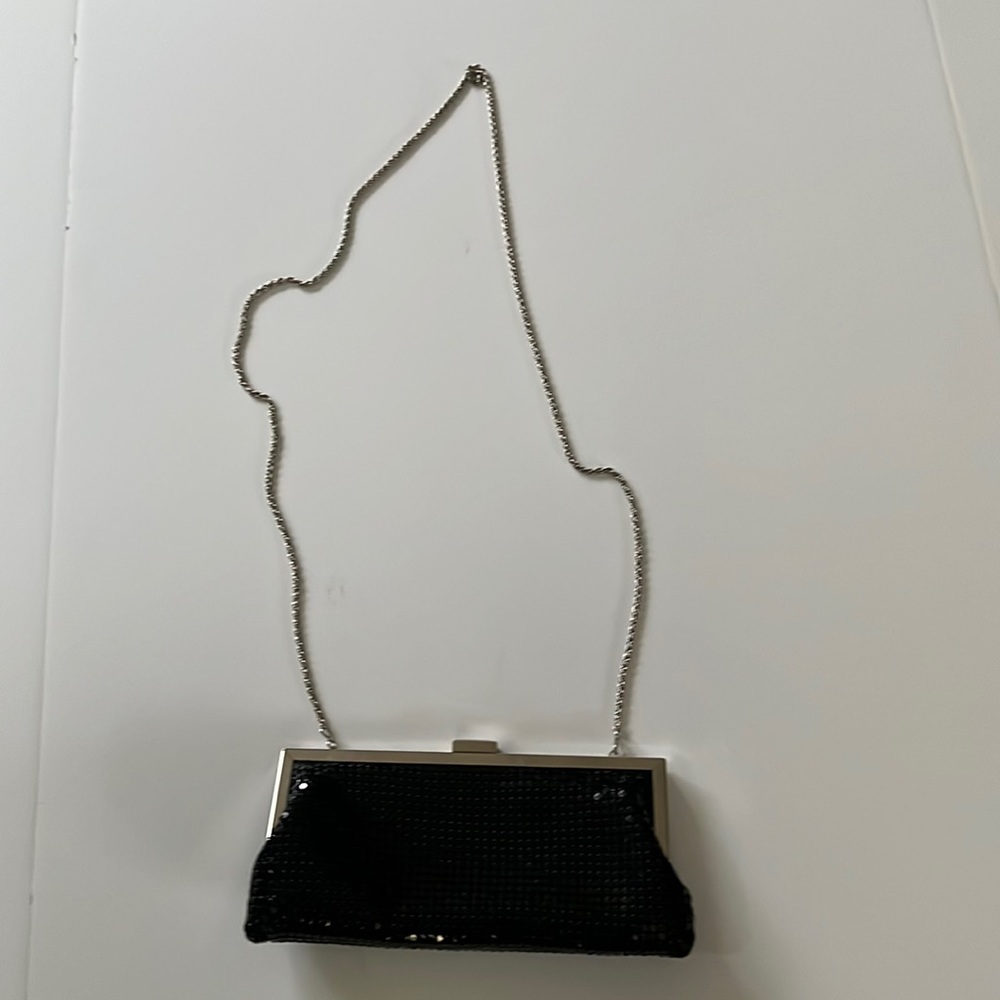 Small black sequin evening bag with shoulder chain strap.